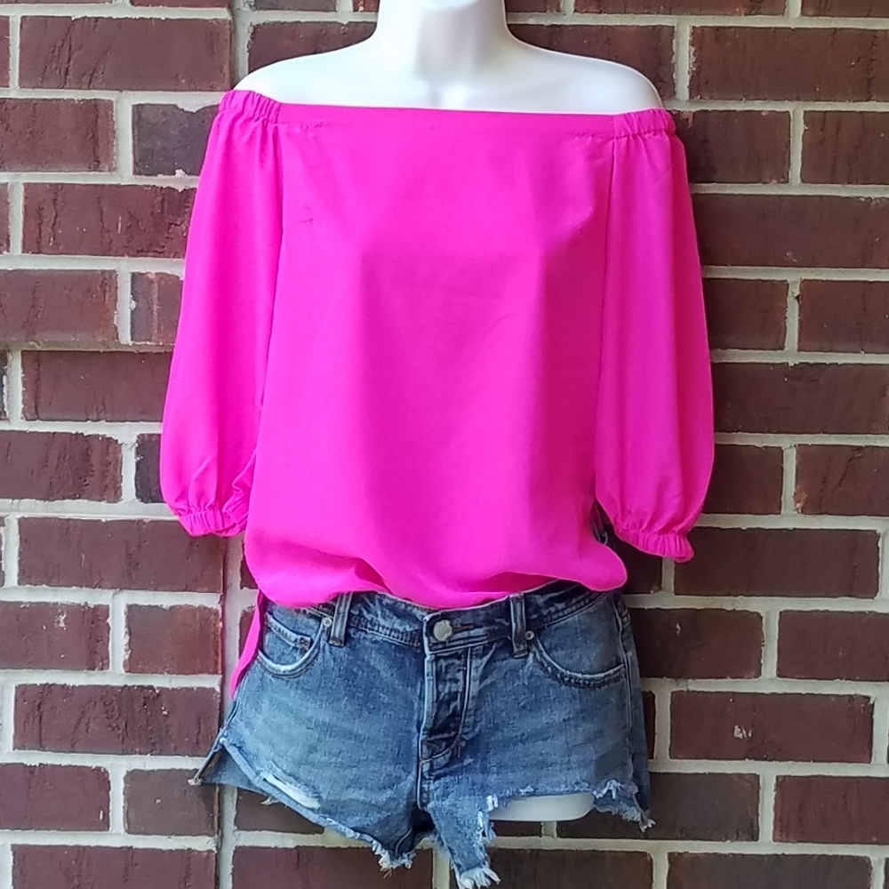 Amanda U. Bright pink off the shoulder top.